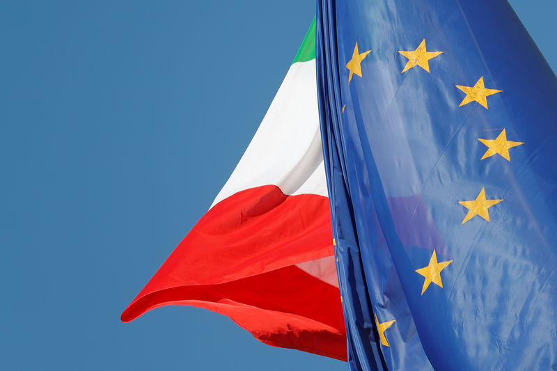 © Reuters. European Union and Italian flags are seen in downtown Rome