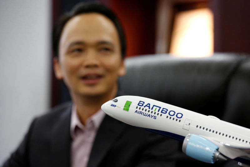 © Reuters. FILE PHOTO - Vietnam's Bamboo Airways Chairman Trinh Van Quyet is seen at his office in Hanoi