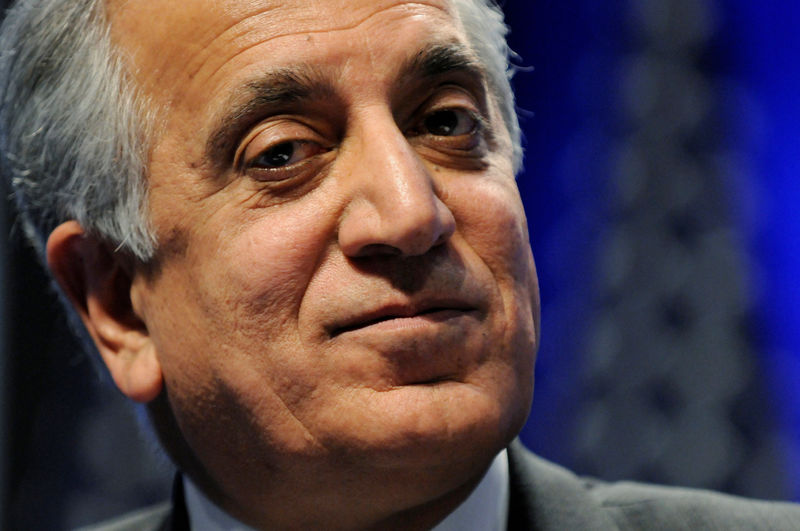 © Reuters. FILE PHOTO: Khalilzad listens to speakers during a panel discussion on Afghanistan at the Conservative Political Action conference (CPAC) in Washington