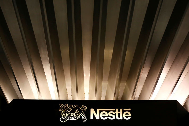 © Reuters. FILE PHOTO: The Nestle logo is pictured on the company headquarters entrance building in Vevey