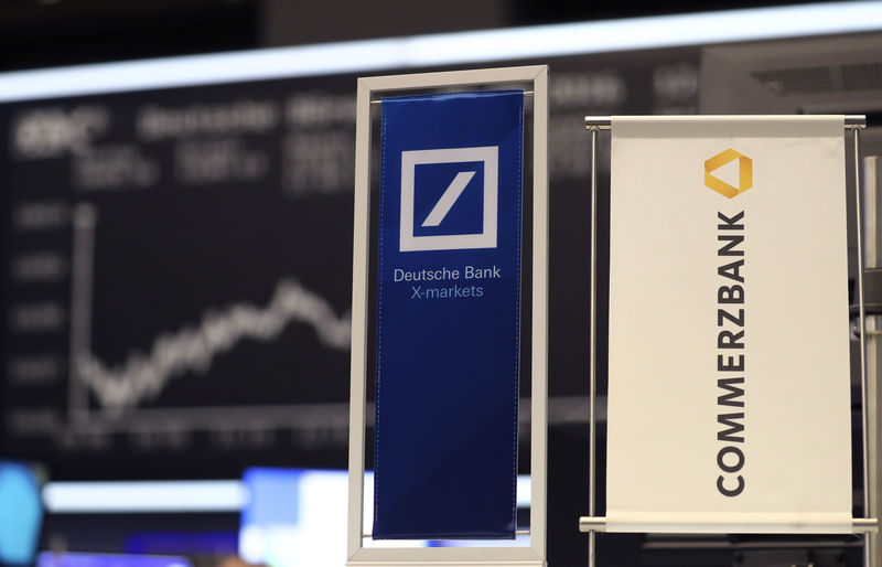 © Reuters. Banners of Deutsche Bank and Commerzbank are pictured in front of the German share price index, DAX in Frankfurt