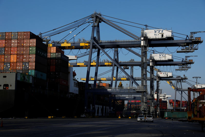 © Reuters. Shipping containers are stacked on a ship docked at Yusen Terminals at the Port of Los Angeles