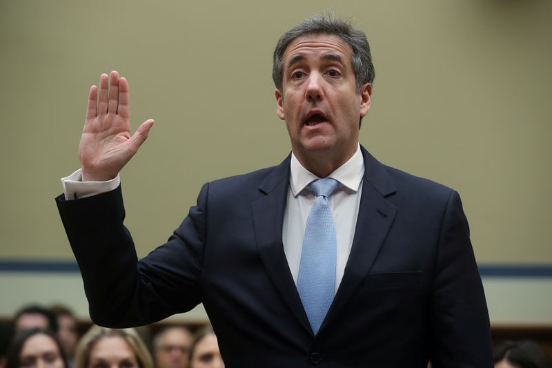 © Reuters. Former Trump personal attorney Cohen is sworn in to testify before House Oversight hearing on Capitol Hill in Washington