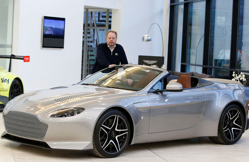 © Reuters. Andy Palmer, CEO of Aston Martin poses for a photograph at their world headquarters in Gaydon