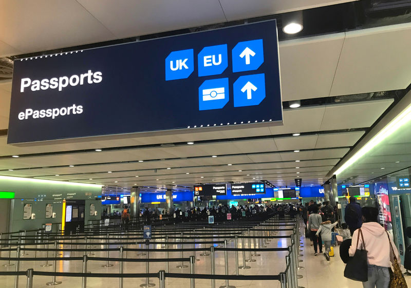 © Reuters. Signage is seen at the UK border control point at the arrivals area of Heathrow Airport, London