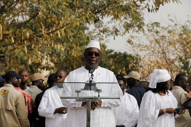 © Reuters. Senegal's President and a candidate for the presidential elections Macky Sall, speaks after casting his vote at a polling station in Fatick