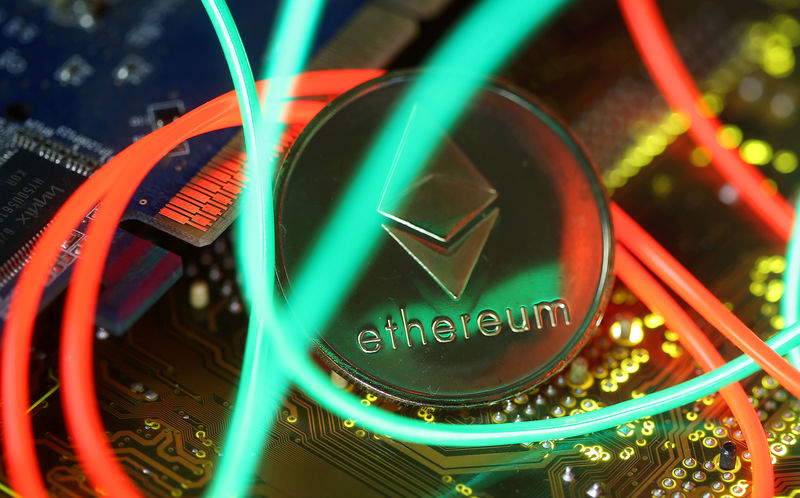 © Reuters. FILE PHOTO: Representation of the Ethereum virtual currency standing on the PC motherboard are seen in this illustration picture