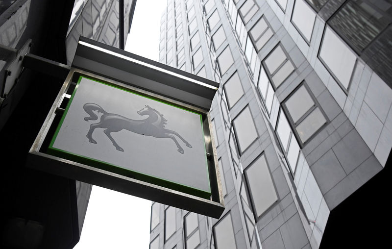 © Reuters. FILE PHOTO: A Lloyds Bank sign hangs outside one of its London branchesbranch in London