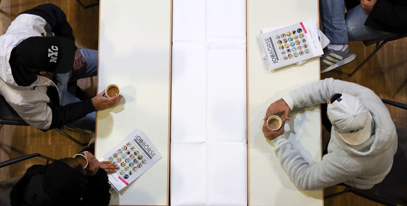 © Reuters. People visit a job fair for migrants in Berlin