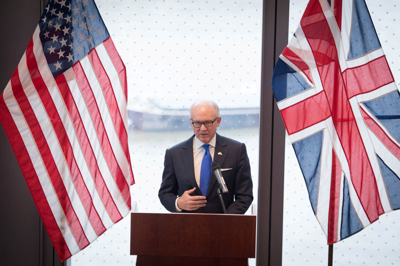 © Reuters. FILE PHOTO:  United States ambassador to the Court of St James Woody Johnson speaks during a press preview at the new United States embassy building near the River Thames in London