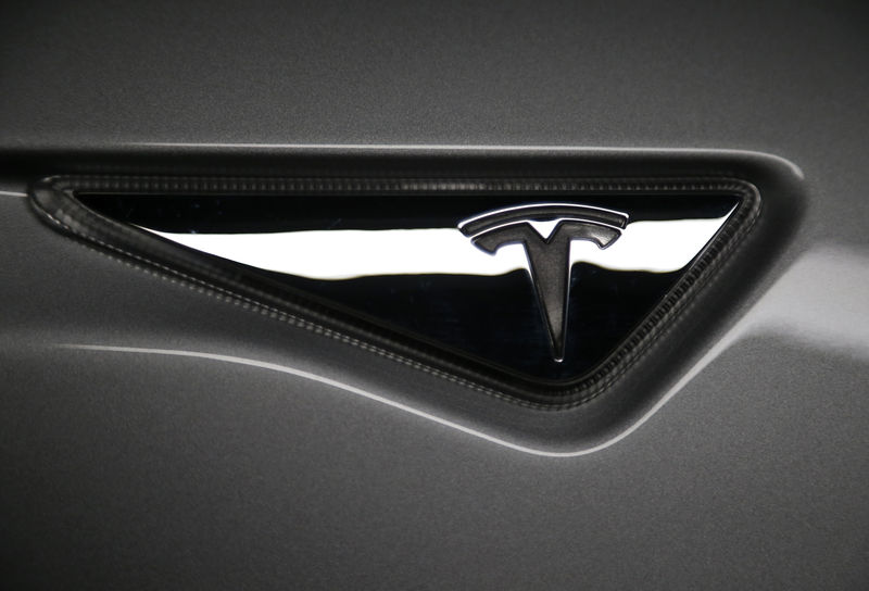 © Reuters. FILE PHOTO - The logo is seen on a new all-wheel-drive version of the Tesla Model S car in Hawthorne