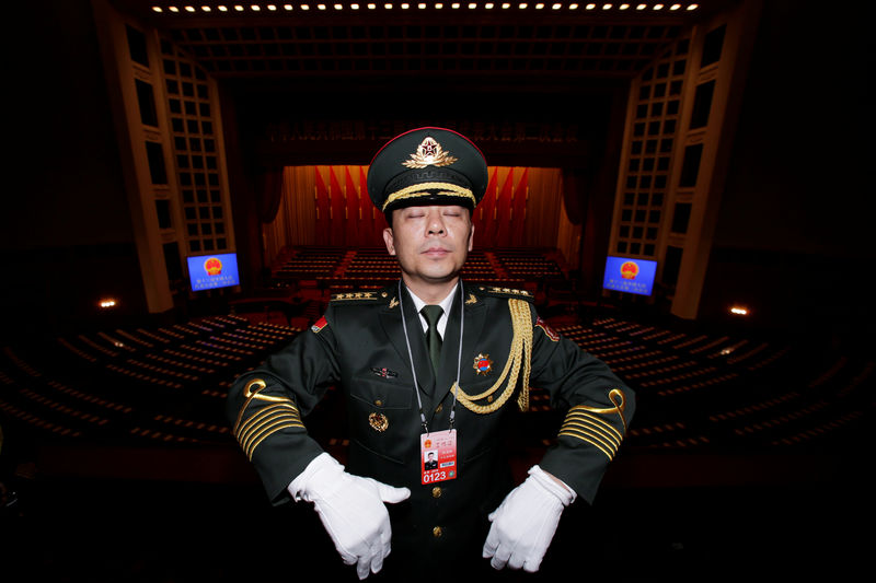 © Reuters. Military band member rehearses for the opening session of the National People's Congress (NPC) at the Great Hall of the People in Beijing