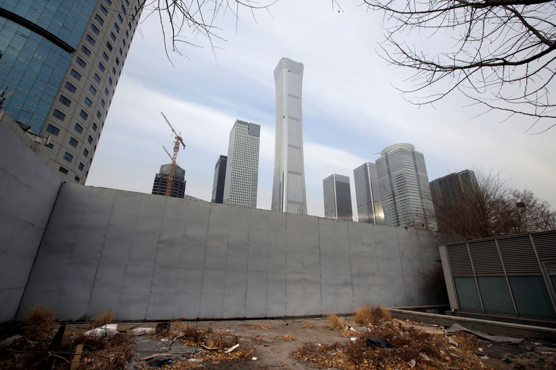 © Reuters. Buildings are seen behind a fence in Beijing's central business area