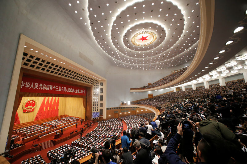 © Reuters. Delegates and journalists attend the National People's Congress (NPC) at the Great Hall of the People in Beijing