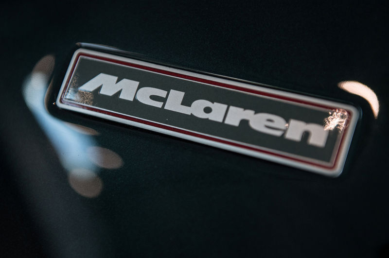 © Reuters. FILE PHOTO: A McLaren badge is seen on the bonnet of a car in a show room at the McLaren Technology Centre in Woking