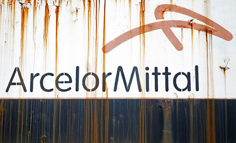 © Reuters. FILE PHOTO: Steel factory ArcelorMittal's logo is seen on an old train in Zenica