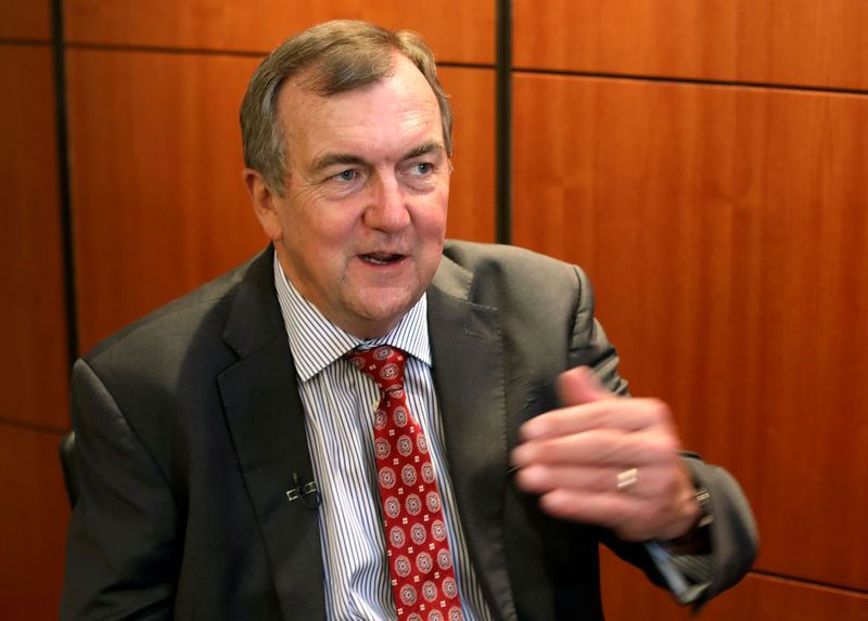 © Reuters. FILE PHOTO: Mark Bristow, chief executive officer of Barrick Gold, speaks during an interview at the Investing in African Mining Indaba conference in Cape Town