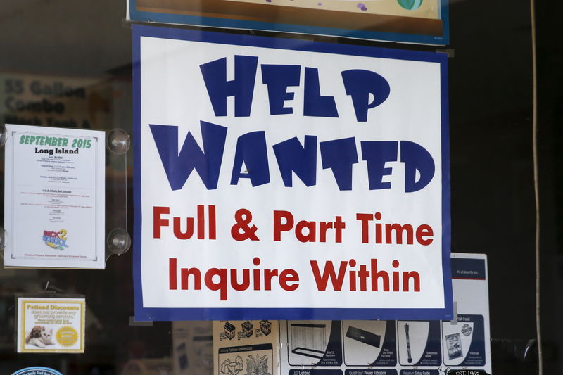 © Reuters. FILE PHOTO: An advertisement for job openings is seen outside a store  in Port Washington, New York