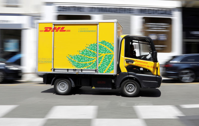 © Reuters. FILE PHOTO: A DHL delivery van drives along a street in Nice