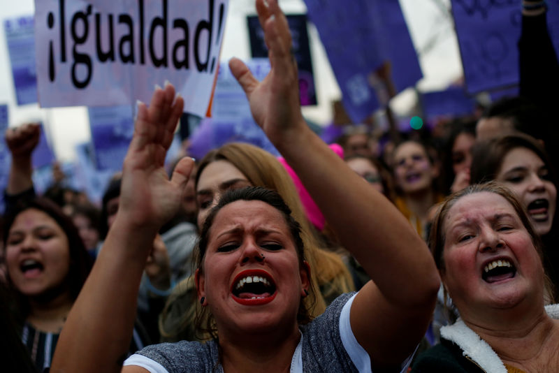 © Reuters. FILE PHOTO: Protesters take part in a demonstration during a nationwide feminist strike on International Women's Day in Madrid