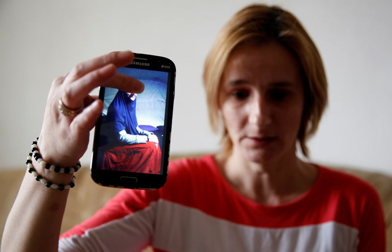 © Reuters. Alema Dolamic, shows a picture of her sister who went to Syria, in Bedaci village, near Tesanj