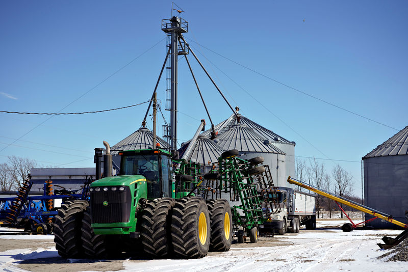 © Reuters. Farm equipment and grain storage belonging to farmer Austin Rincker sit outside in Moweaqua Illinois