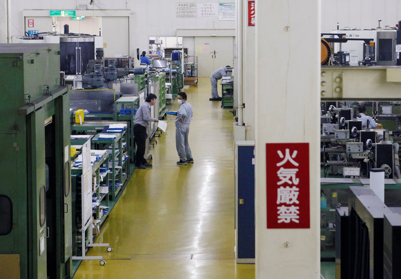 © Reuters. Workers are seen at the factory of Nagumo Seisakusho Co., Ltd. in Jyoetsu