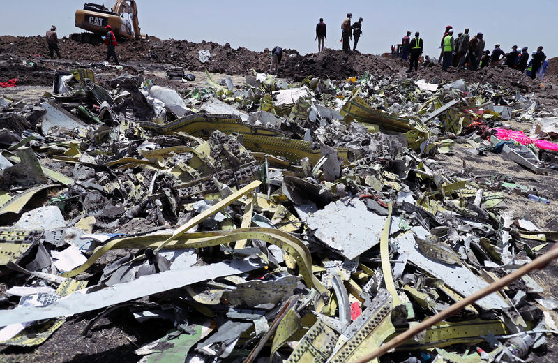 © Reuters. Wreckage is seen at the site of the Ethiopian Airlines Flight ET 302 plane crash near Bishoftu
