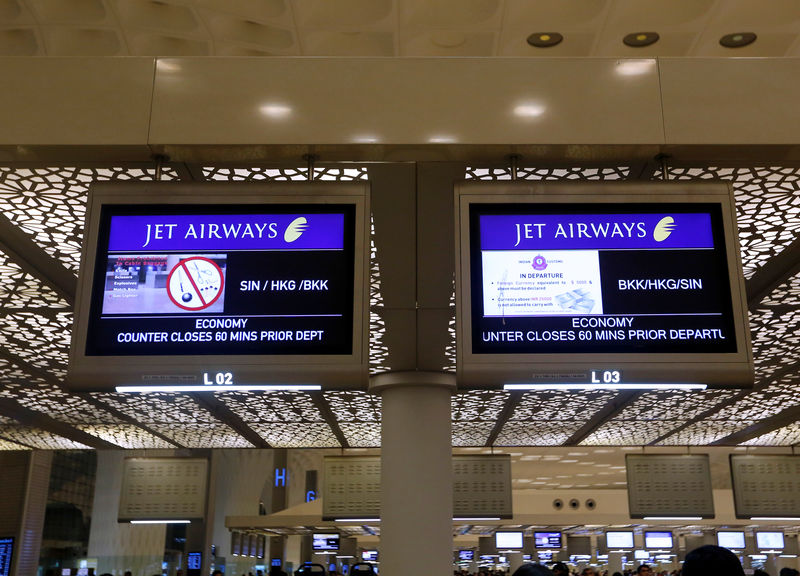 © Reuters. FILE PHOTO: Jet Airways flight information is seen at check-in counters inside the international airport in Mumbai