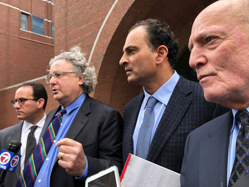 © Reuters. David Sidoo -- along with attorneys Richard Schonfeld, David Chesnoff and Martin Weinber -- speaks outside Boston federal court after pleading not guilty to charges of participating in the largest college admissions fraud scheme in U.S. history in Boston