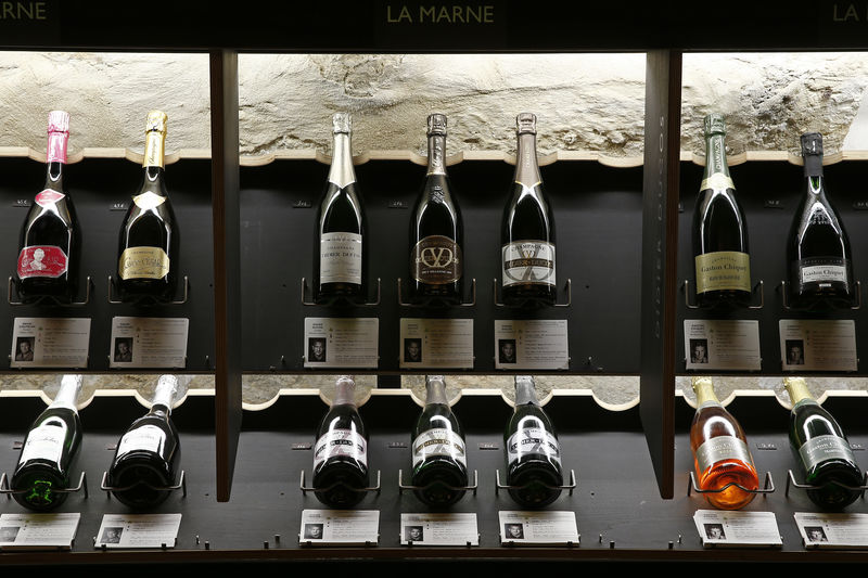 © Reuters. Bottles of Champagne are displayed at Dilettantes wine shop in Paris