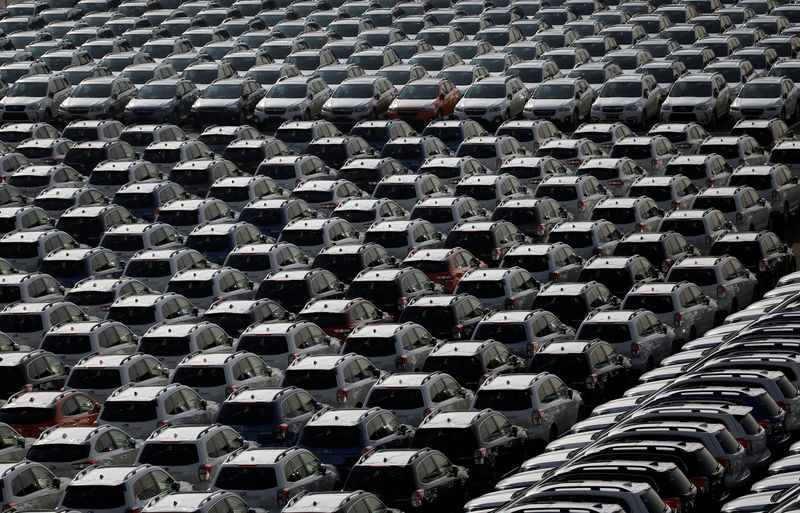 © Reuters. FILE PHOTO: Newly manufactured cars await export at port in Yokohama