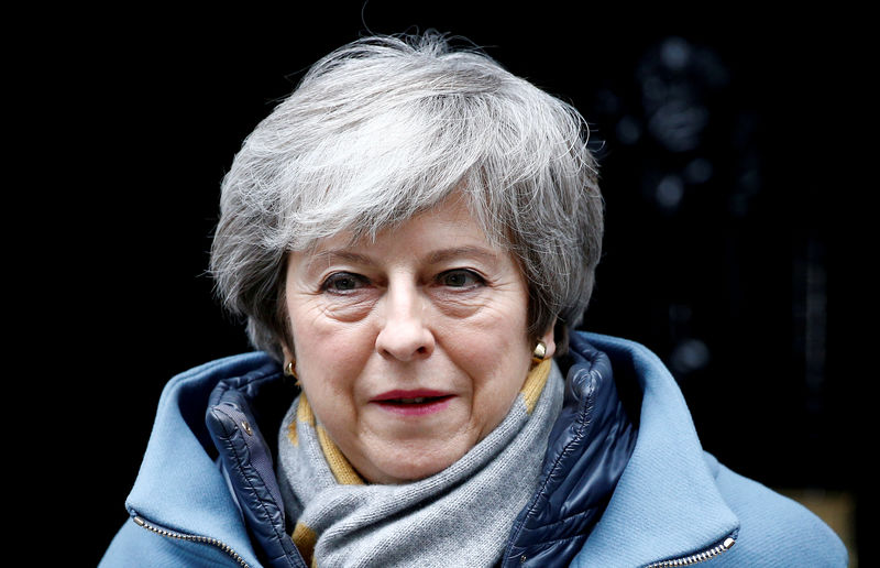 © Reuters. FILE PHOTO: British PM May walks outside Downing Street in London