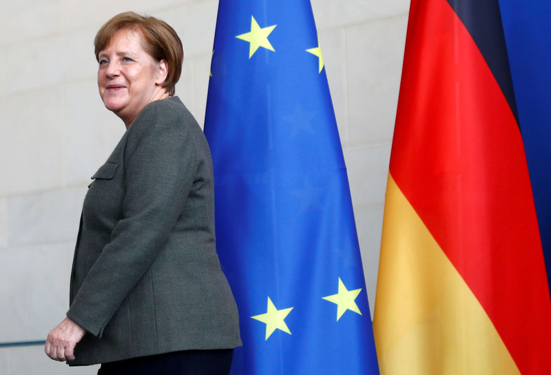 © Reuters. FILE PHOTO: German Chancellor Angela Merkel leaves a news conference at the Chancellery in Berlin