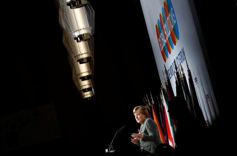 © Reuters. German Chancellor Angela Merkel gives a speech at the annual Global Solutions Summit in Berlin