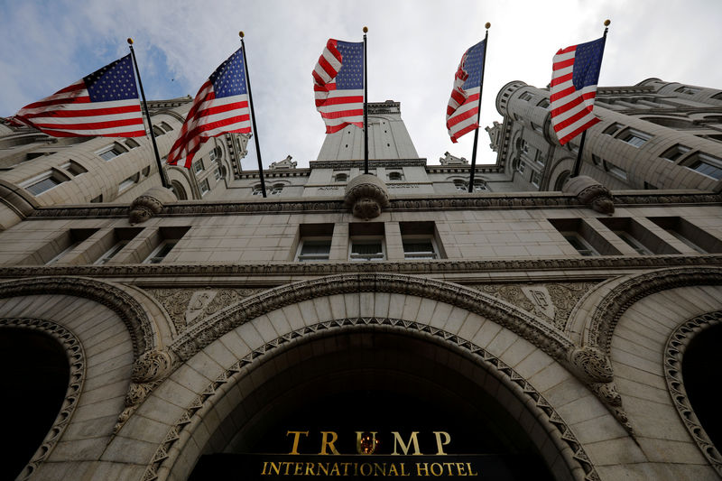 © Reuters. FILE PHOTO: U.S. flags fly over the Trump International Hotel in Washington