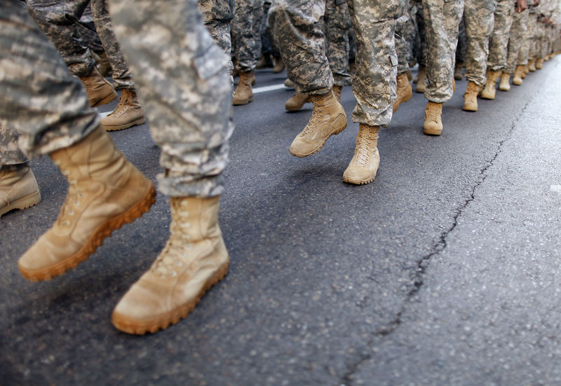 © Reuters. FILE PHOTO - Members of the Army march up 5th Avenue during the Veterans Day Parade in New York