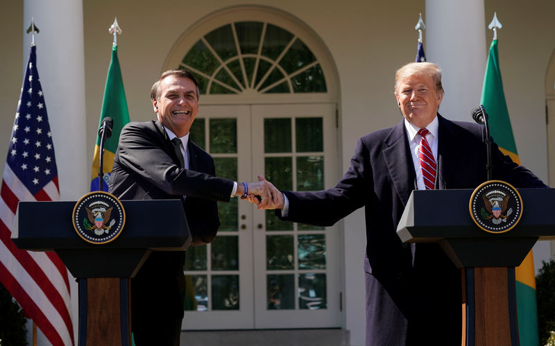 © Reuters. U.S. President Donald Trump and Brazil's President Jair Bolsonaro hold a joint news conference at the White House in Washington