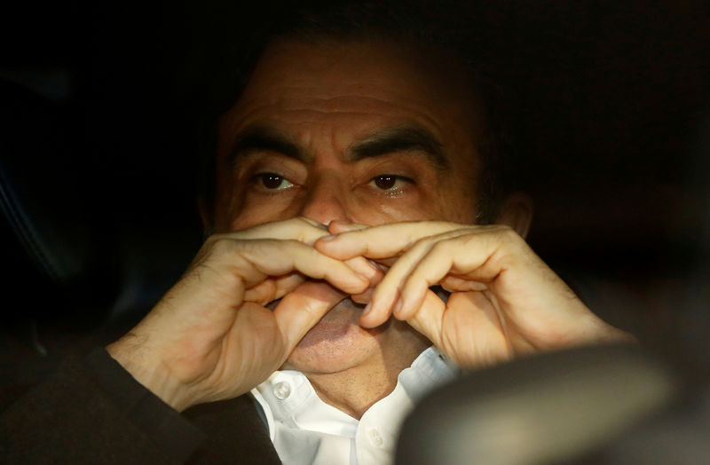 © Reuters. FILE PHOTO: Former Nissan Motor Chairman Carlos Ghosn sits inside the car as he leaves his lawyer's office after being released on bail from Tokyo Detention House, in Tokyo