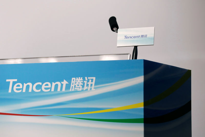 © Reuters. Logos of Tencent are displayed at a news conference in Hong Kong, China