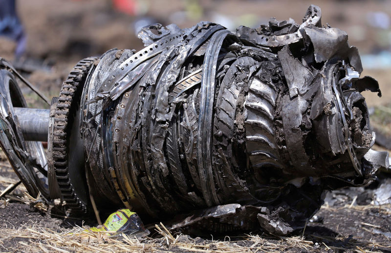 © Reuters. FILE PHOTO: Airplane engine parts are seen at the scene of the Ethiopian Airlines Flight ET 302 plane crash, near the town of Bishoftu