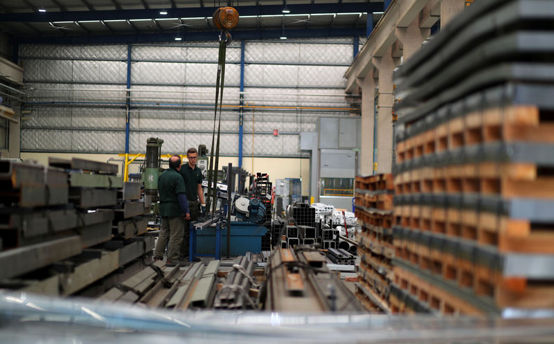© Reuters. FILE PHOTO:  Employees work at industrial manufacturing company Gottert in Garin