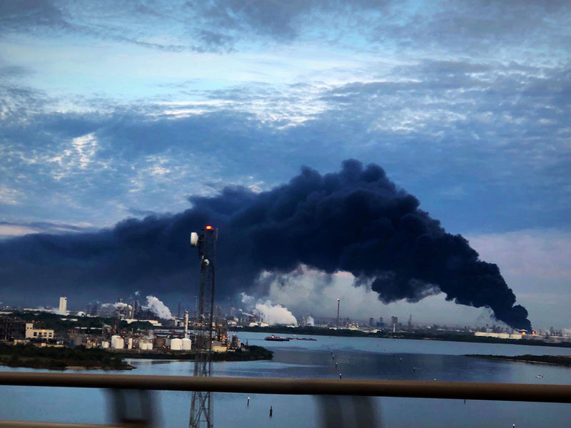 © Reuters. Handout photo of smoke rising from a fire burning at the Intercontinental Terminals Company in Deer Park, east of Houston