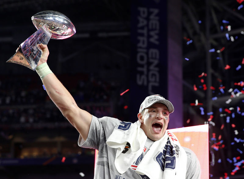 © Reuters. FILE PHOTO:  New England Patriots tight end Rob Gronkowski holds up the Vince Lombardi Trophy after his team defeated the Seattle Seahawks in the NFL Super Bowl XLIX football game in Glendale