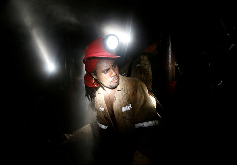 © Reuters. FILE PHOTO: Miner works deep underground at Sibanye Gold's Masimthembe shaft in Westonaria