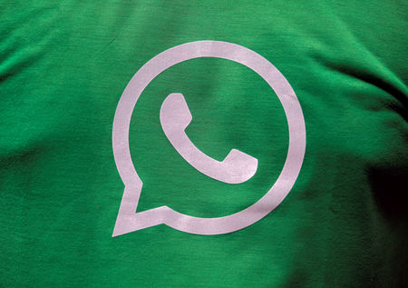 © Reuters. A logo of WhatsApp is pictured on a T-shirt worn by a WhatsApp-Reliance Jio representative during a drive by the two companies to educate users, on the outskirts of Kolkata