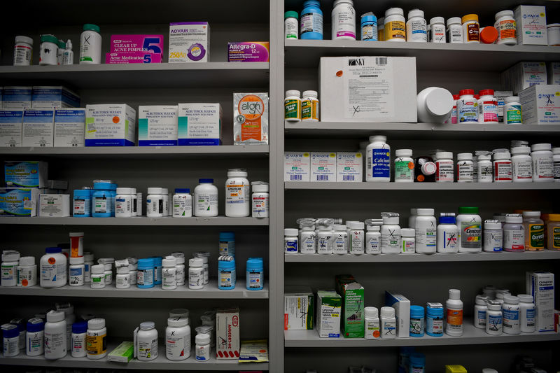 © Reuters. FILE PHOTO - Bottles of medications line the shelves at a pharmacy in Portsmouth