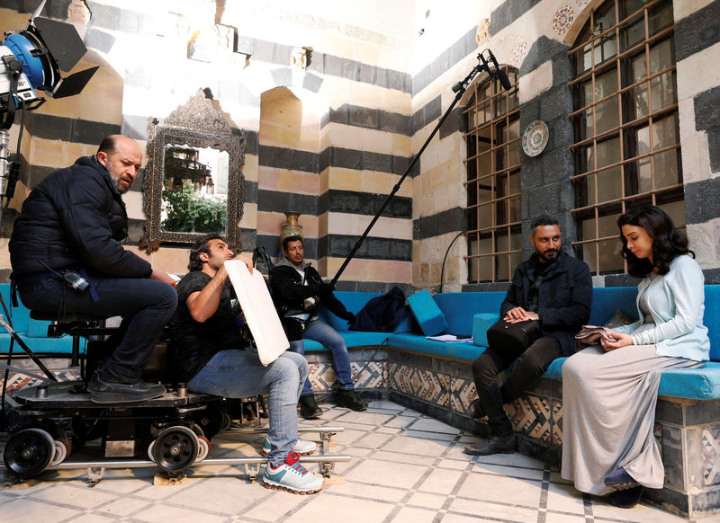 © Reuters. Qays al-Sheikh Najib, 41, a Syrian actor performs a scene in the new Syrian series called "A Safe Distance\\