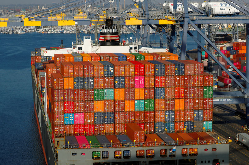 © Reuters. FILE PHOTO: Shipping containers are pictured stacked on a ship docked at Yusen Terminals at the Port of Los Angeles