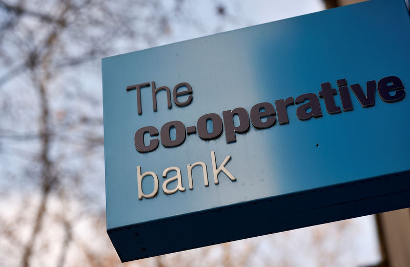 © Reuters. FILE PHOTO: A sign hangs outside of a branch of The Co-operative Bank in London